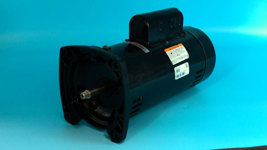 Rebuilt 2.0 HP square flange pool motor  painted black  blue background